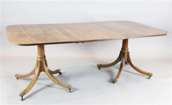 A George III style mahogany twin pillar dining table, extends to 10ft x 3ft 8in. H.2ft 3in.